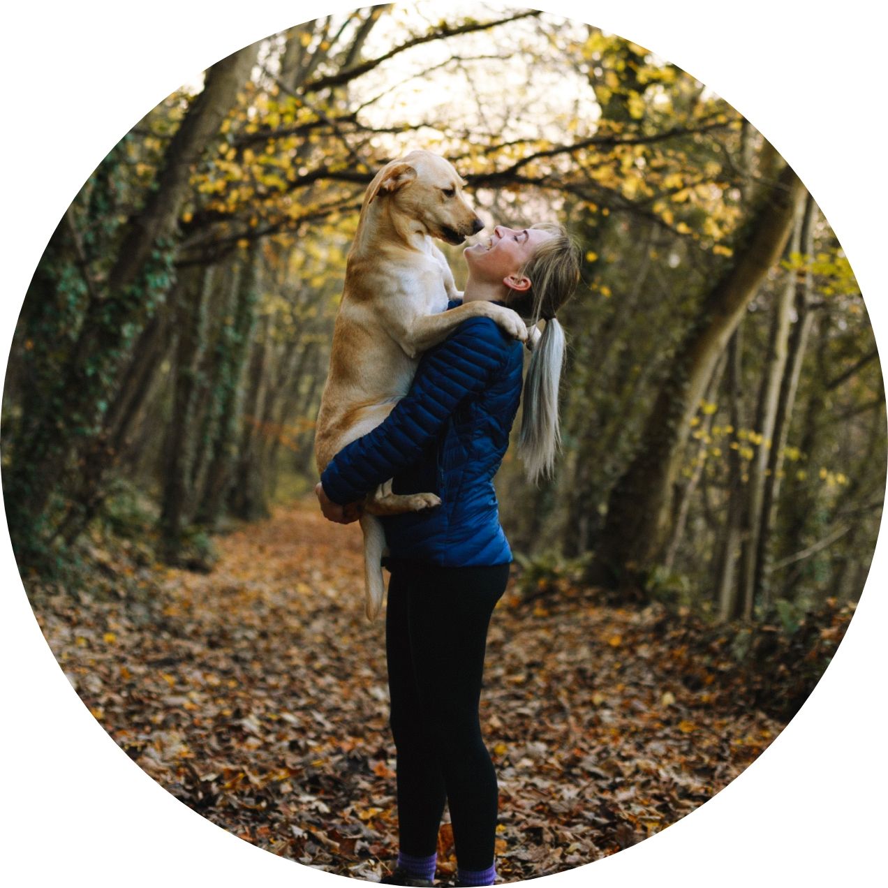 woman and her dog going for a hike